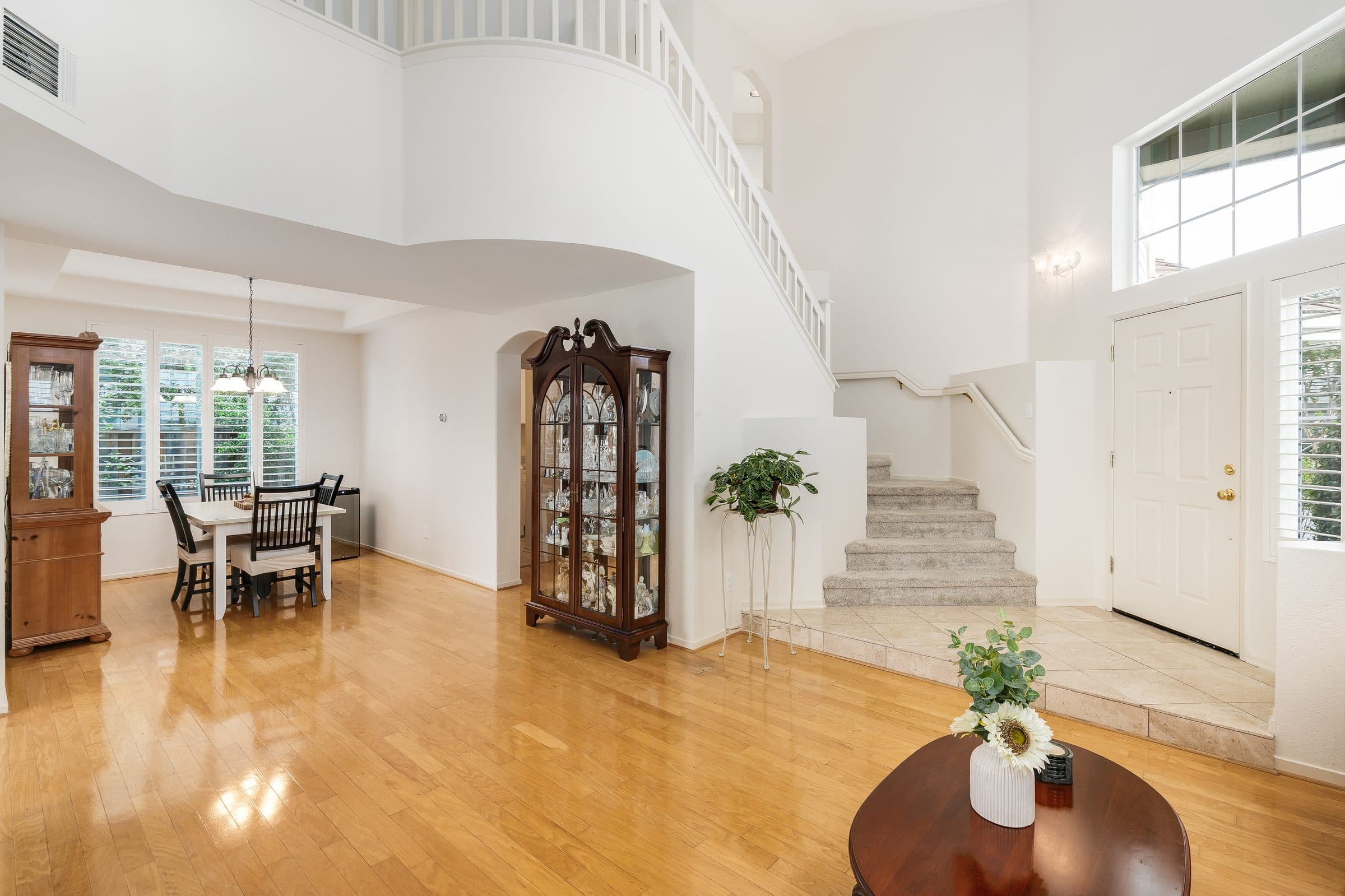 1049 Feather Circle. The living room and the curving stair to the floor above.