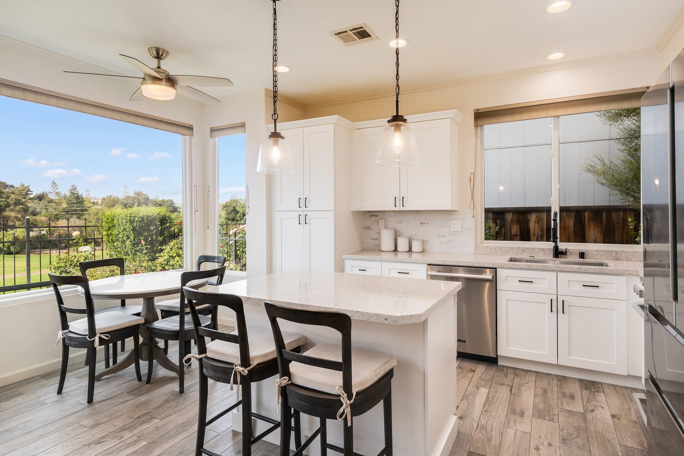 1049 Feather Circle. The kitchen, with an island and windows onto the course.