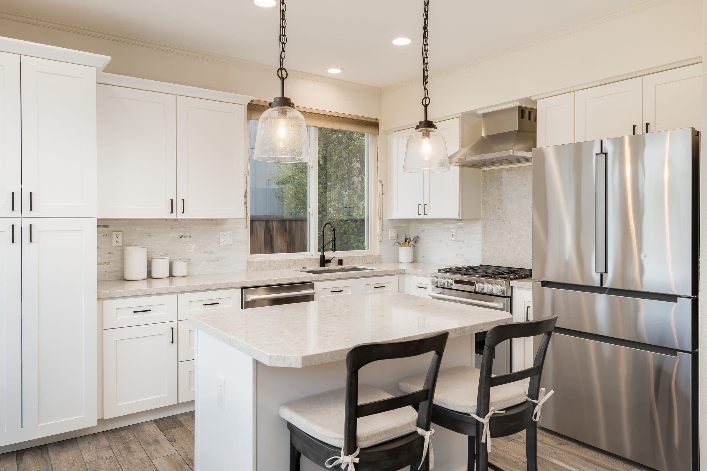 1049 Feather Circle. White cabinetry and stainless appliances.