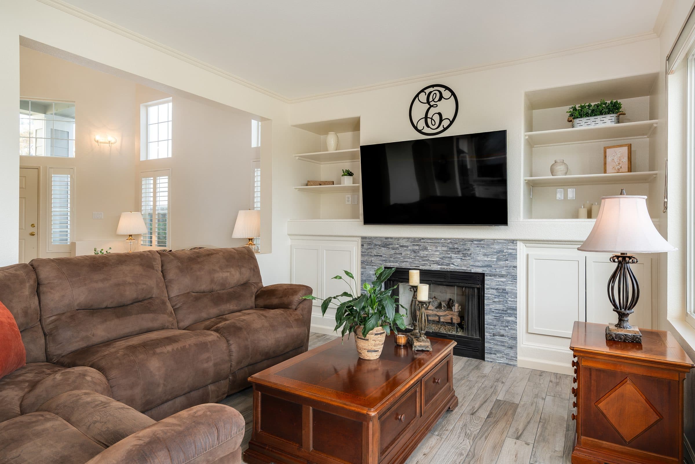 1049 Feather Circle. The fireplace, set in stone with built-in shelving.