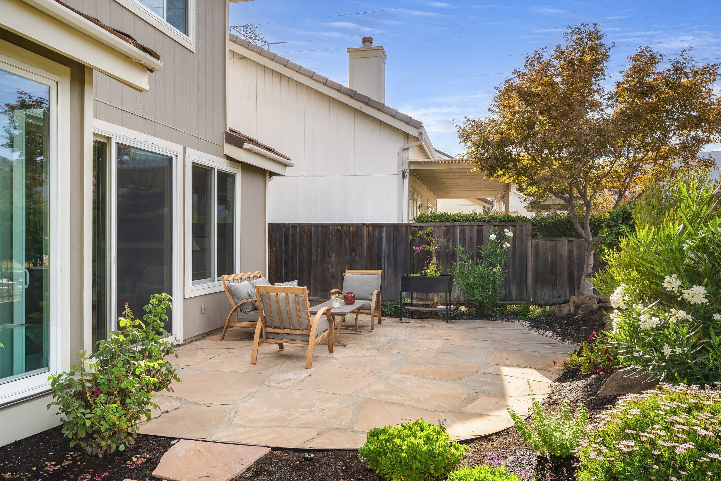 1049 Feather Circle. The patio and garden along the side of the house.